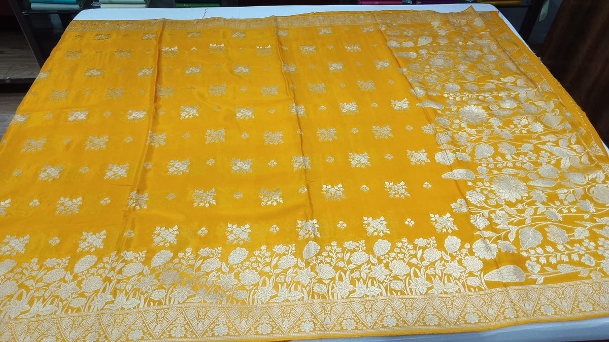 Radiant Mustard Yellow Banarasi Crepe Saree with Antique Silver Floral Zari Border
