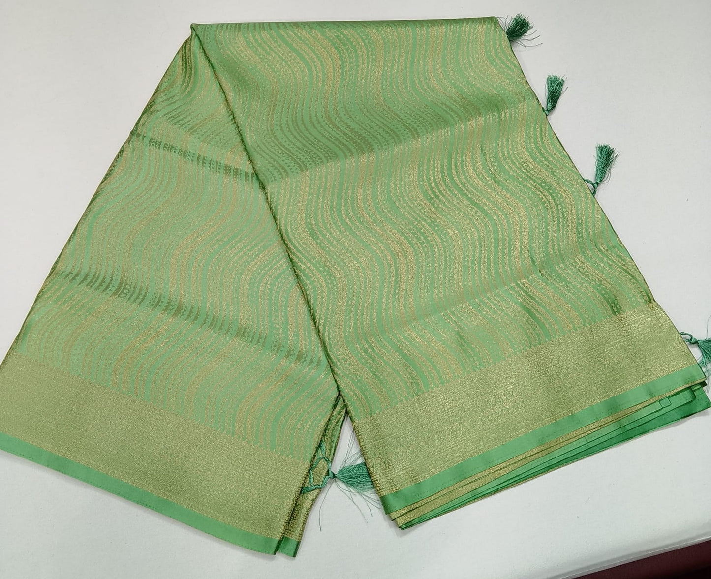 Designer Satin Silk Saree – Pista Green with Golden Wave Zari Weaving