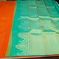 Kanjivaram Borderless Saree – Sunset Orange & Aqua Green with Rich Zari