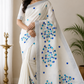 Elegant Off-White Kerala Cotton Saree with Blue Leaf Motif & Silver Kasavu Border
