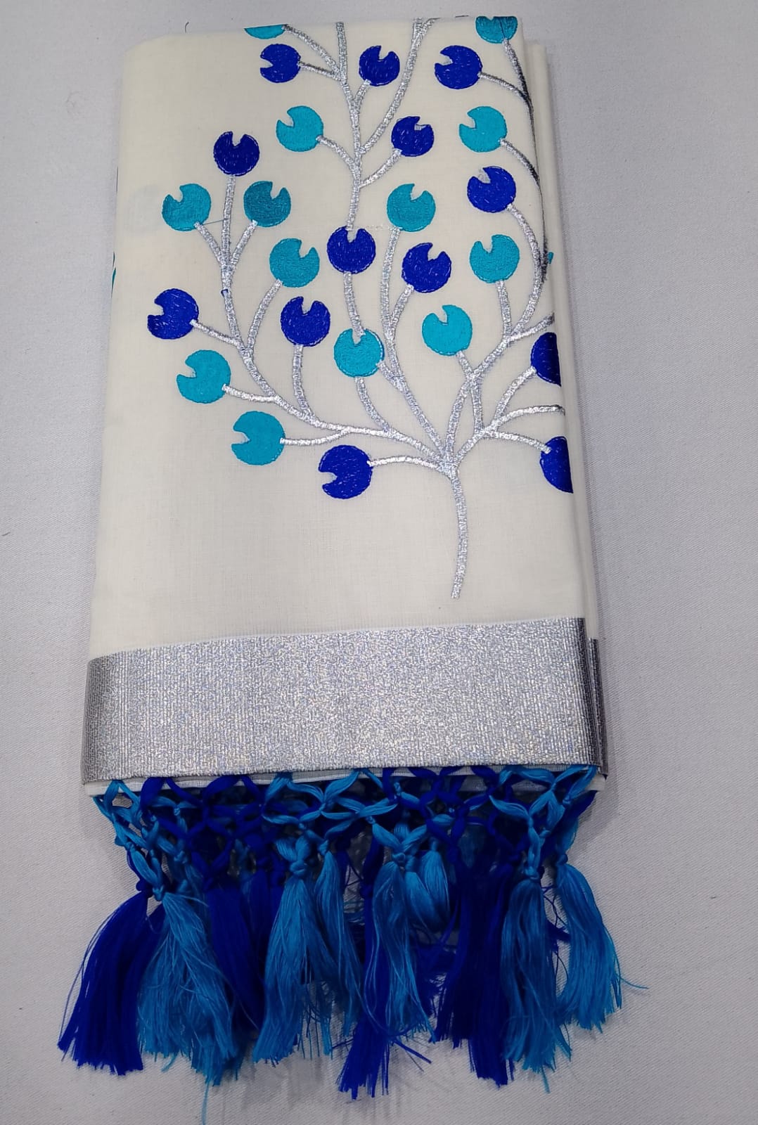 Elegant Off-White Kerala Cotton Saree with Blue Leaf Motif & Silver Kasavu Border