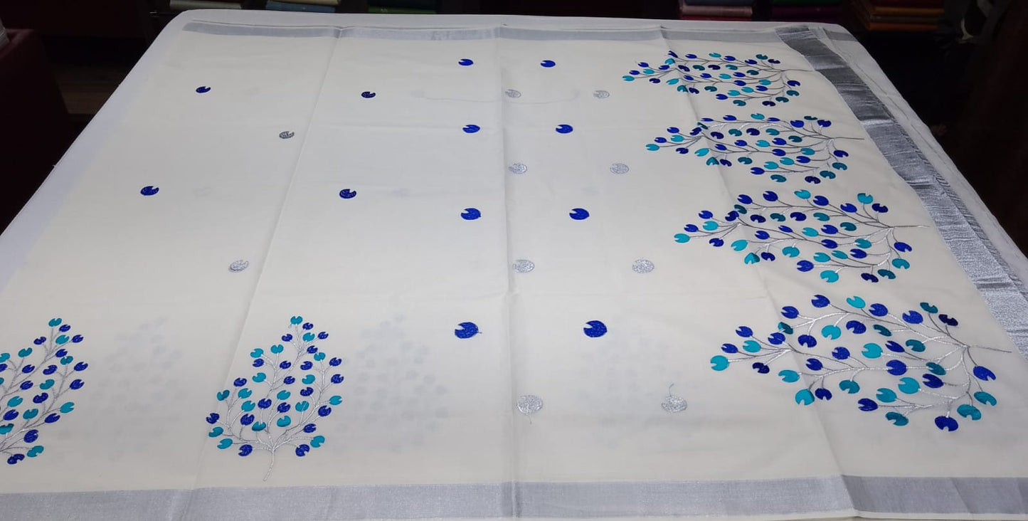 Elegant Off-White Kerala Cotton Saree with Blue Leaf Motif & Silver Kasavu Border