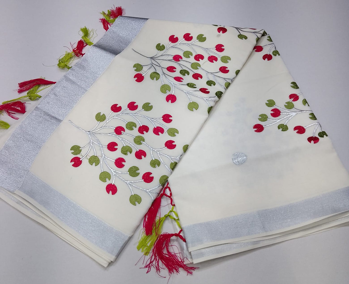 Off-White Kerala Cotton Saree with Pink & Olive Green Leaf Motifs and Silver Kasavu Border