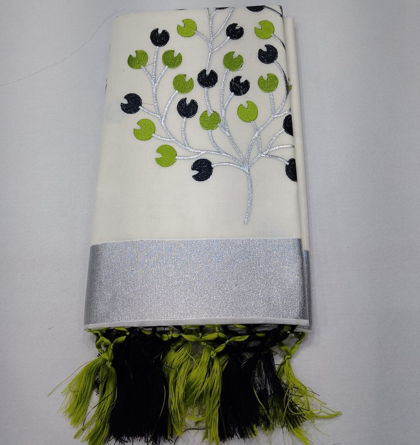 Off-White Kerala Cotton Saree with Black & Parrot Green Leaf Motifs and Silver Kasavu Border