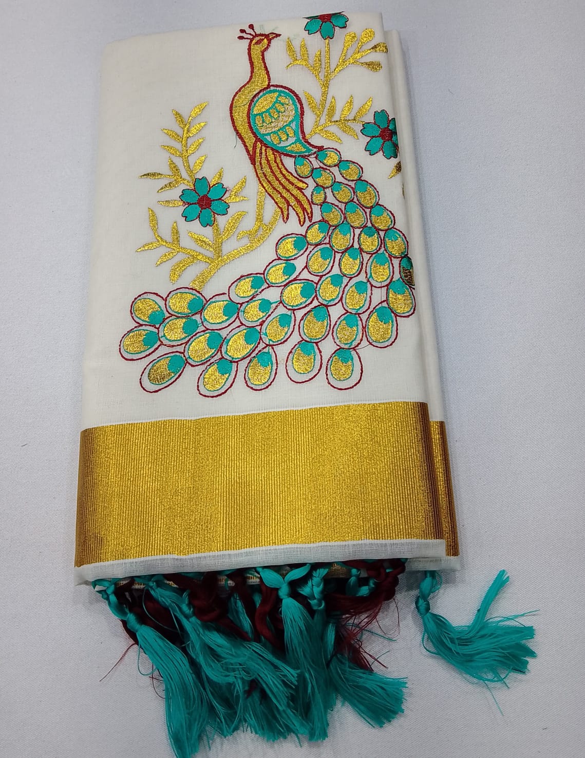 Off-White Kerala Cotton Saree with Peacock Embroidery and Golden Kasavu Border