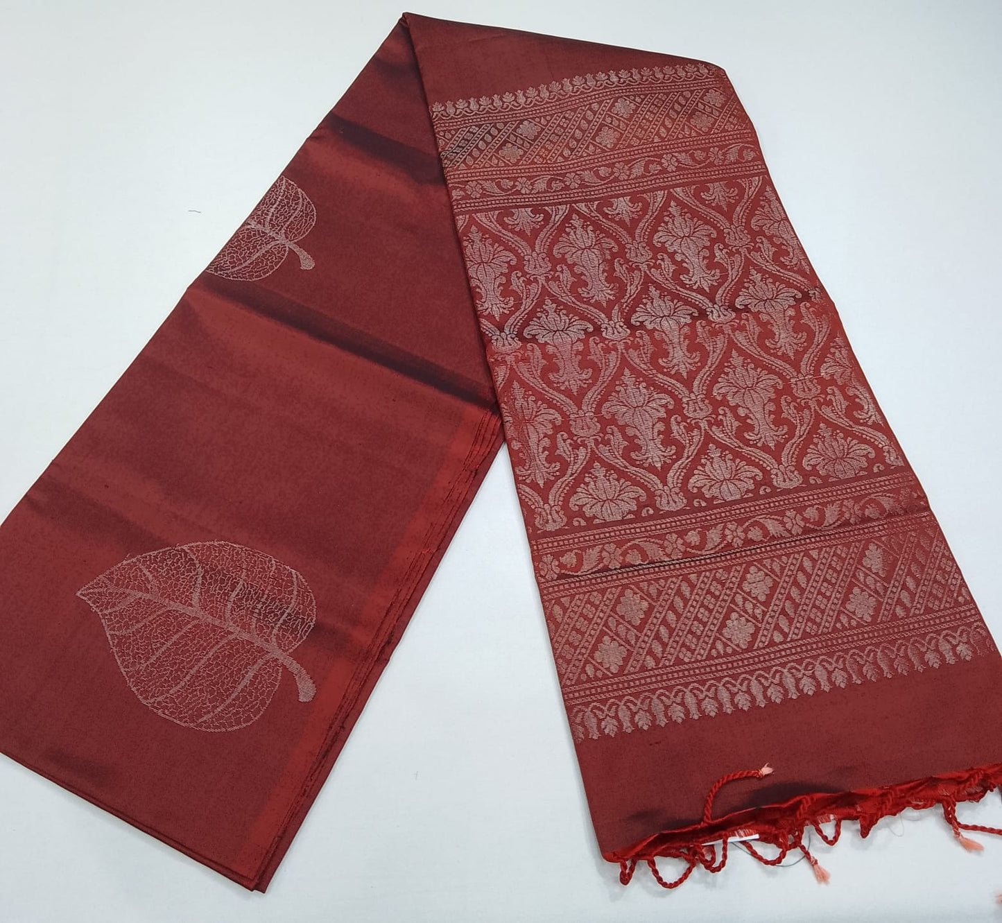 Pure Handloom Soft Silk Borderless Saree – Rust Maroon with Self Woven Leaf & Rich Pallu