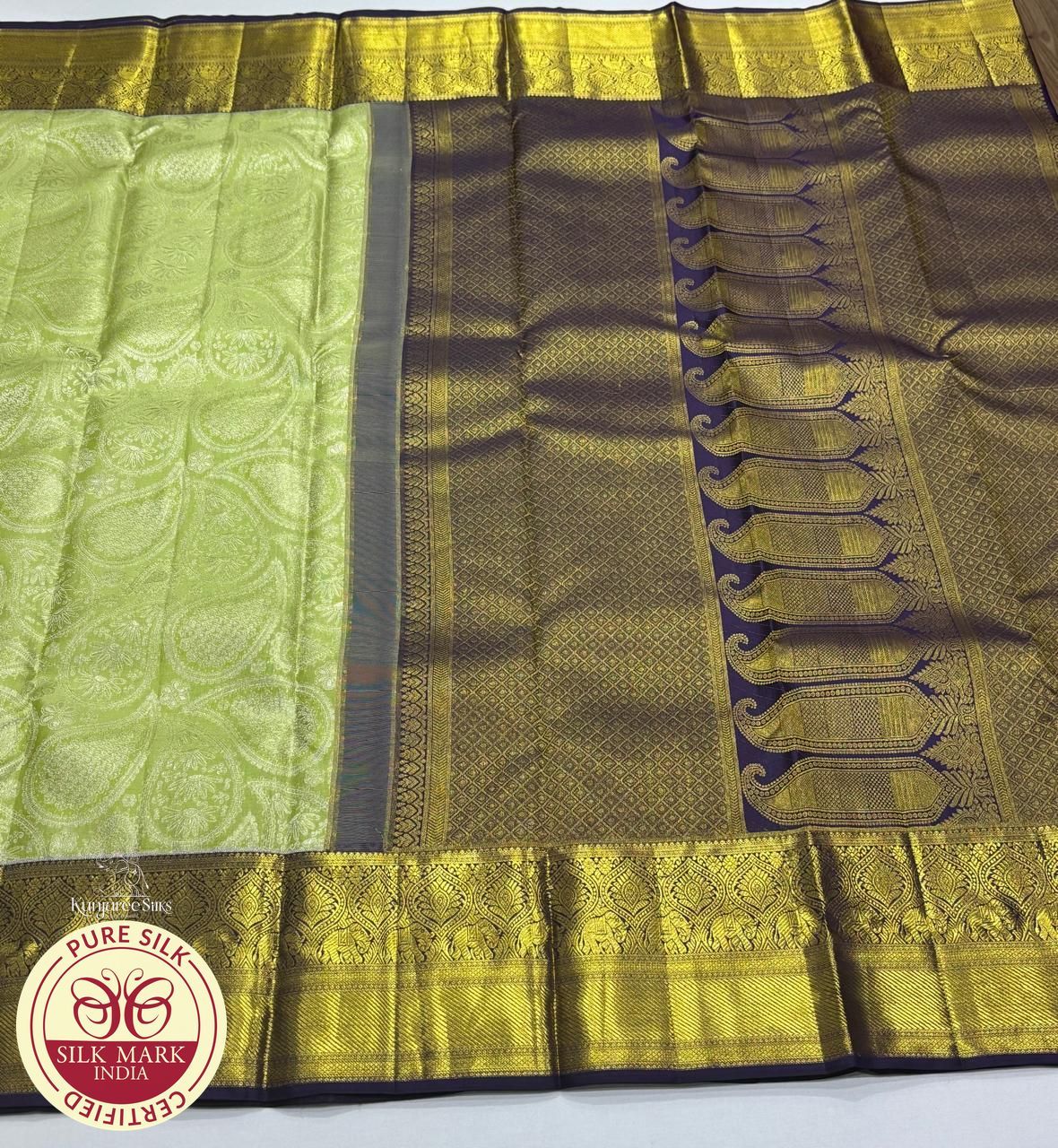 Pure Handloom Kanjivaram Silk Bridal Saree in Pastel Lime Green with Antique Gold Elephant Border & Navy Blue Zari Pallu