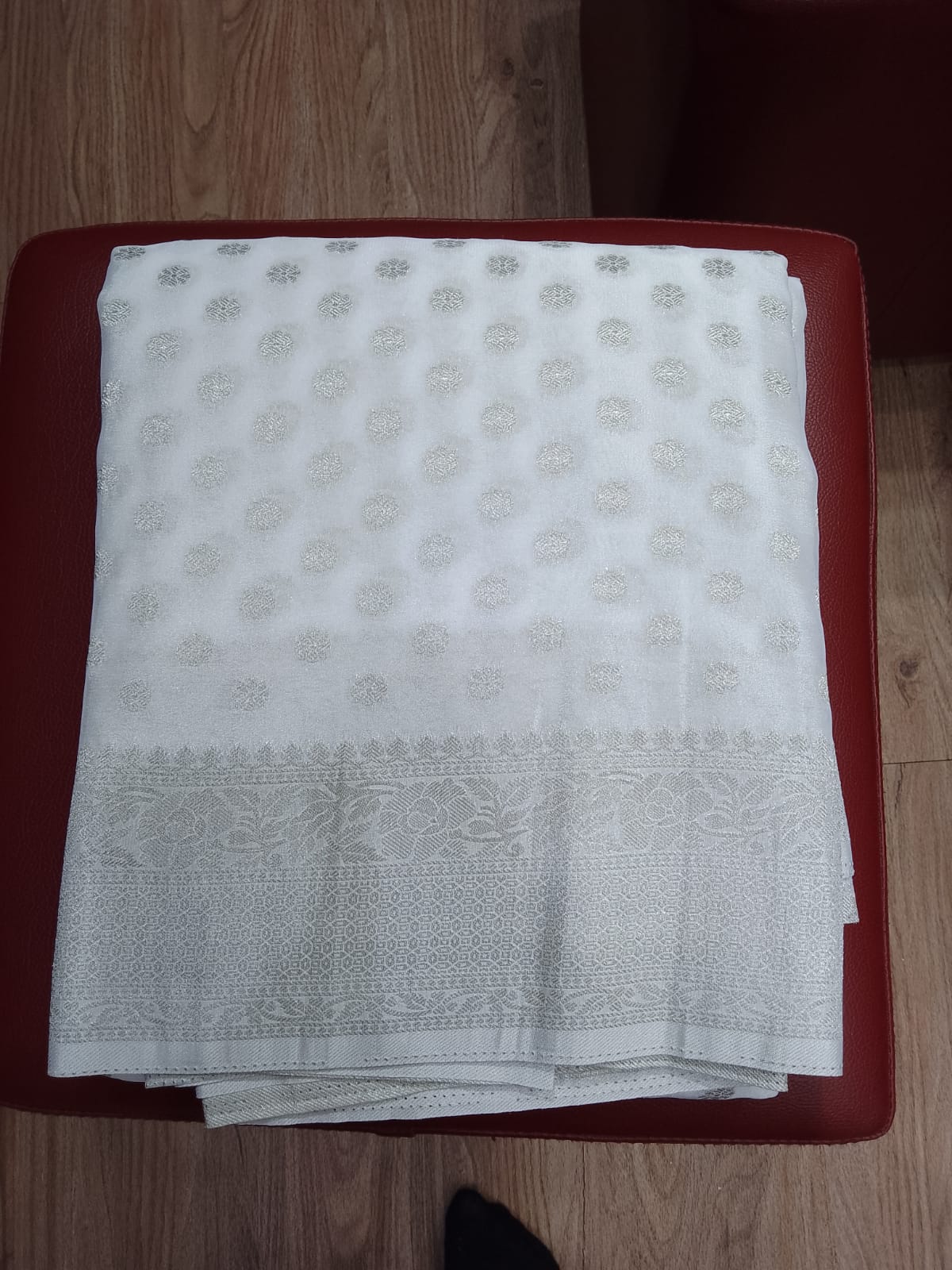 Elegant Pearl White Georgette Chinnon Saree with Silver Zari Buttas