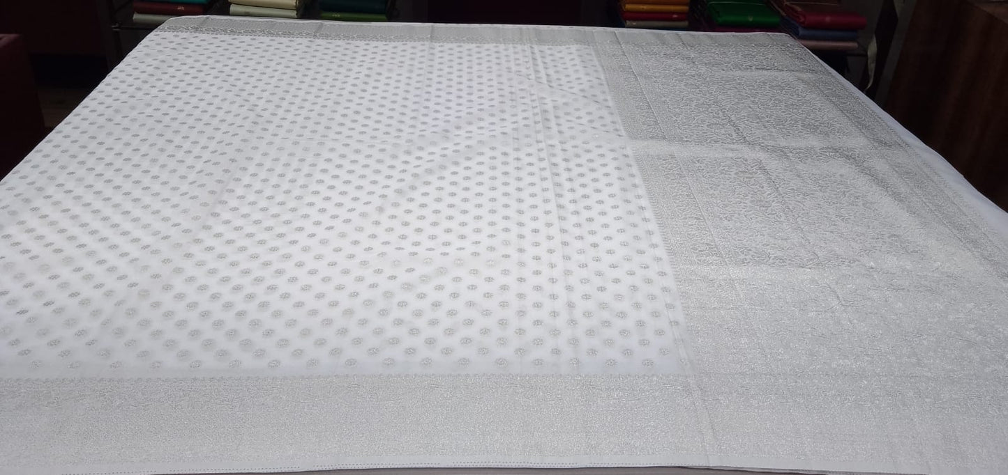Elegant Pearl White Georgette Chinnon Saree with Silver Zari Buttas