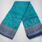 Turquoise Blue Georgette Chinnon Saree with Royal Blue Silver Zari Border