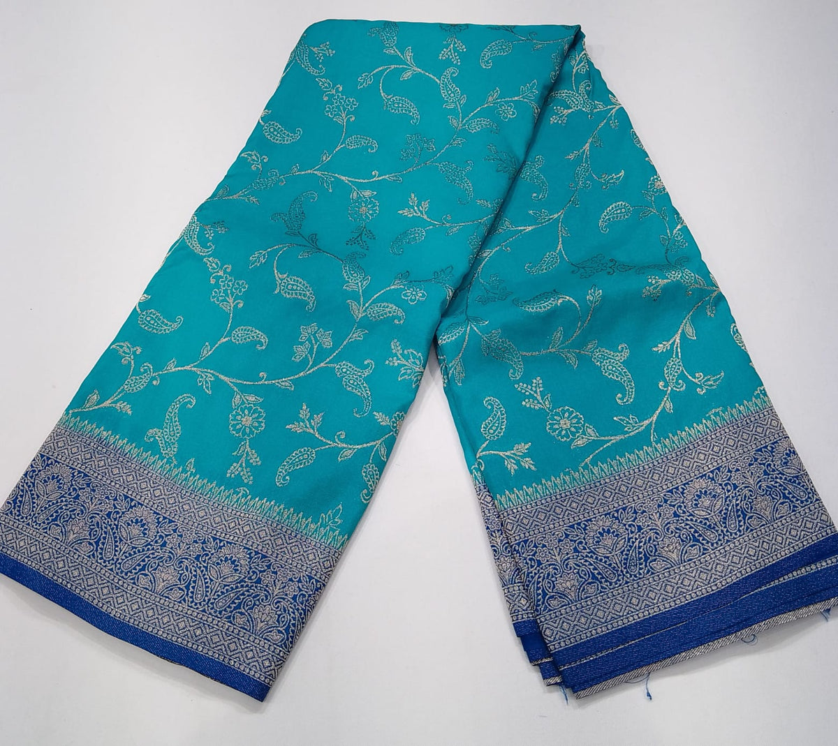 Turquoise Blue Georgette Chinnon Saree with Royal Blue Silver Zari Border