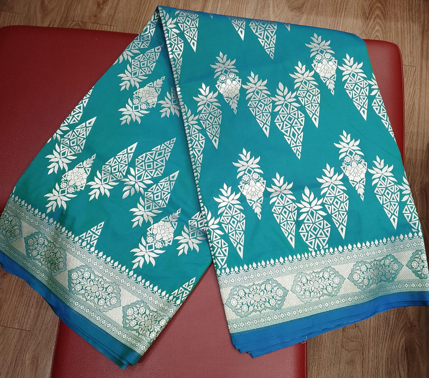 Teal Blue Banarasi Katan Semi Silk Saree with Silver Zari Floral & Paisley Weaves