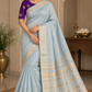 Powder Blue Linen Saree with Antique Gold Zari & Purple Blouse