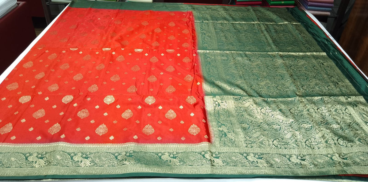 Vermilion Red & Bottle Green Semi Soft Silk Saree with Gold Zari Buttas and Peacock Brocade Pallu