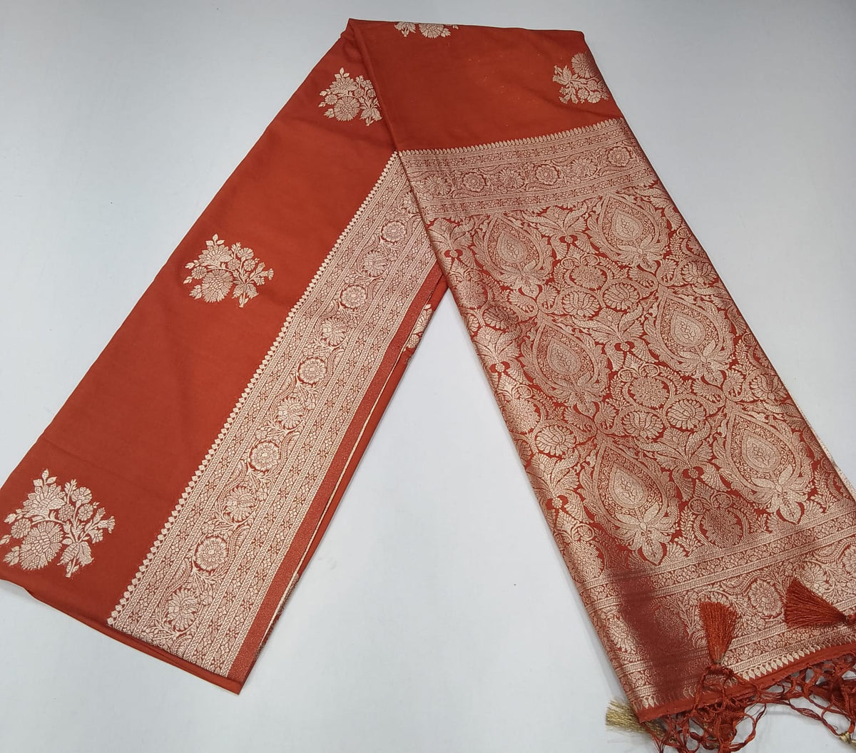 Rust Orange Banarasi Soft Georgette Saree with Silver Zari Floral Buttas and Rich Brocade Pallu