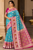 Banarasi Semi Silk -Turquoise Blue with Rani Pink Zari Border & Traditional Elephant Motifs