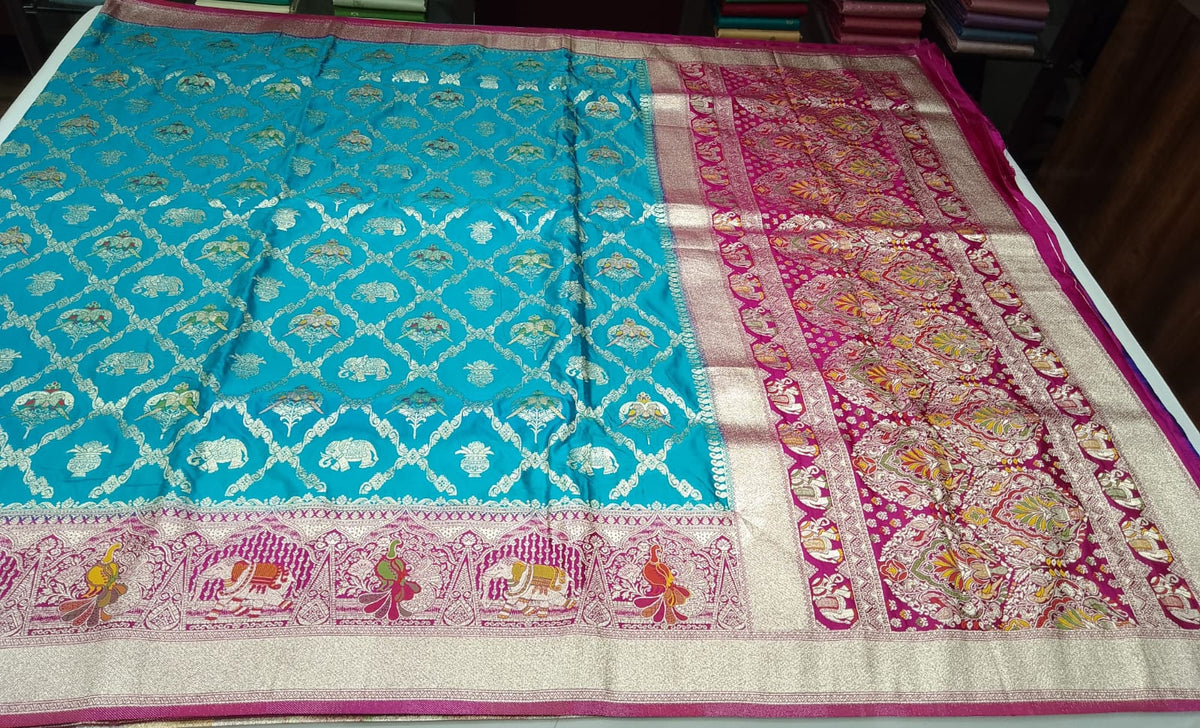 Banarasi Semi Silk -Turquoise Blue with Rani Pink Zari Border & Traditional Elephant Motifs