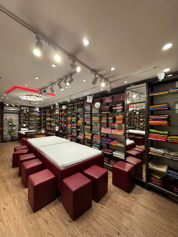 Comfortable seating area for customers at Kunjaree Silks